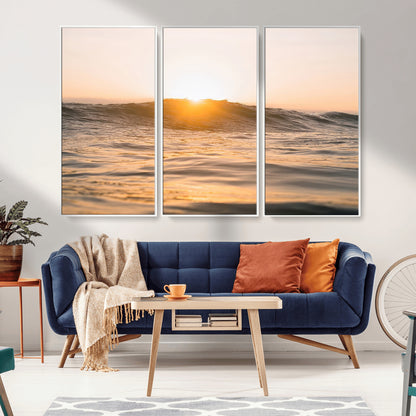 Ocean waves glowing under a warm golden sunset, reflecting soft light and calm movement, perfect for warm minimalist coastal interiors.