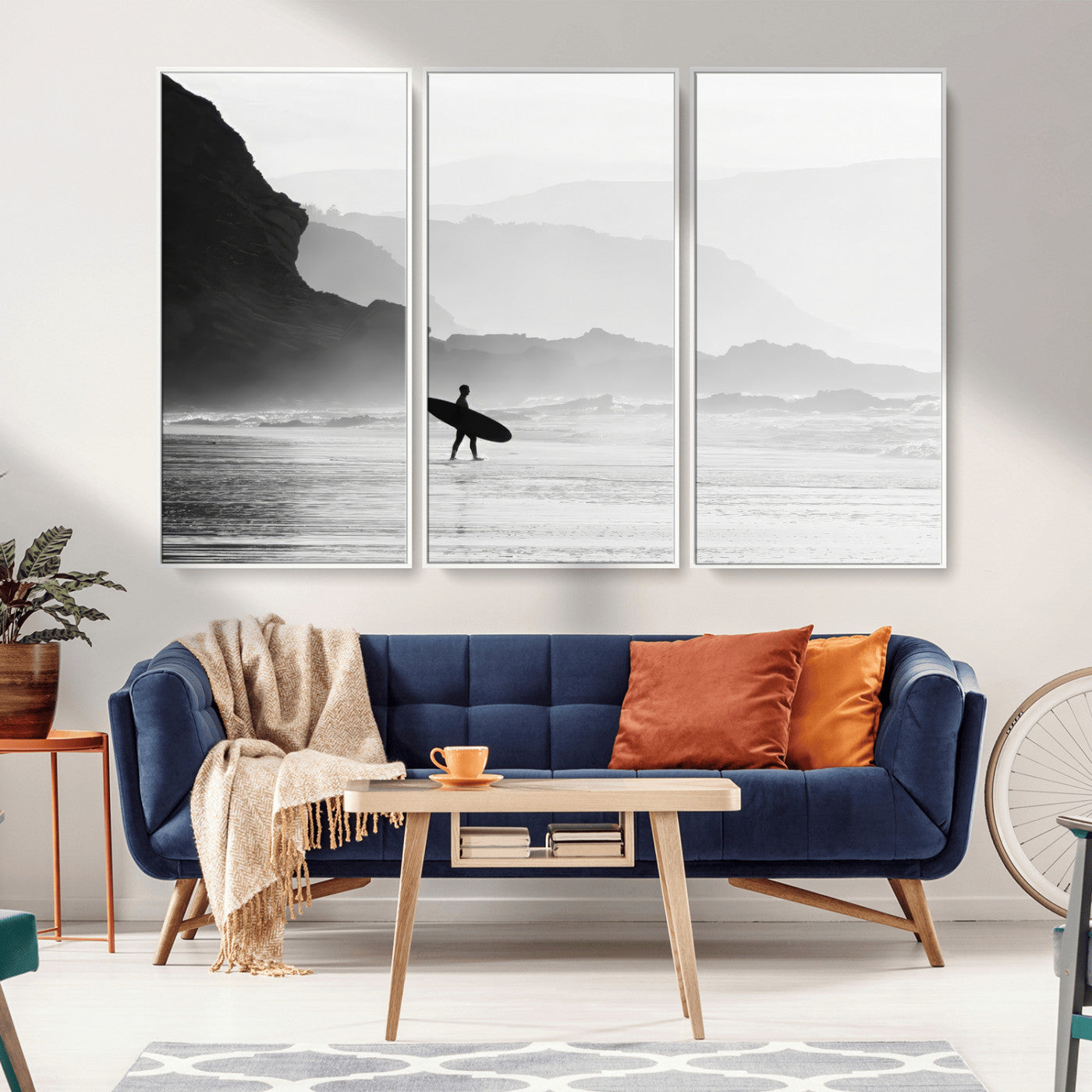 A lone surfer walking along a misty beach with cliffs in the background, carrying their board, capturing a serene and minimal ocean moment.