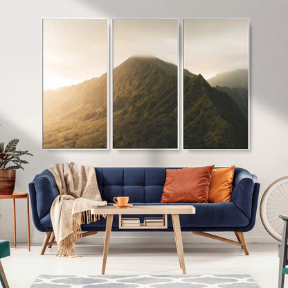 Sunlit mountain peak with mist rolling over its rugged slopes, bathed in golden light, creating a warm and tranquil nature-inspired scene.