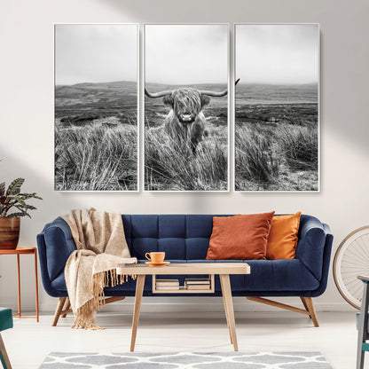 A black and white portrait of a Highland cow in a foggy Scottish countryside, capturing a rustic aesthetic and tranquil farm escape.