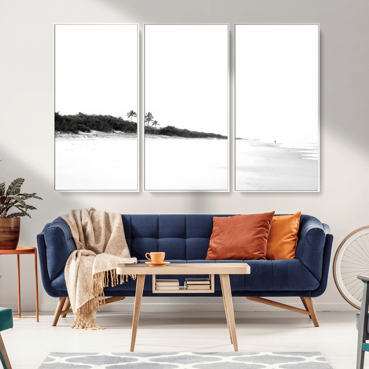 A black and white minimalist coastal scene with a vast open beach, distant palm trees, and a lone figure walking along the shoreline, evoking serenity and solitude.