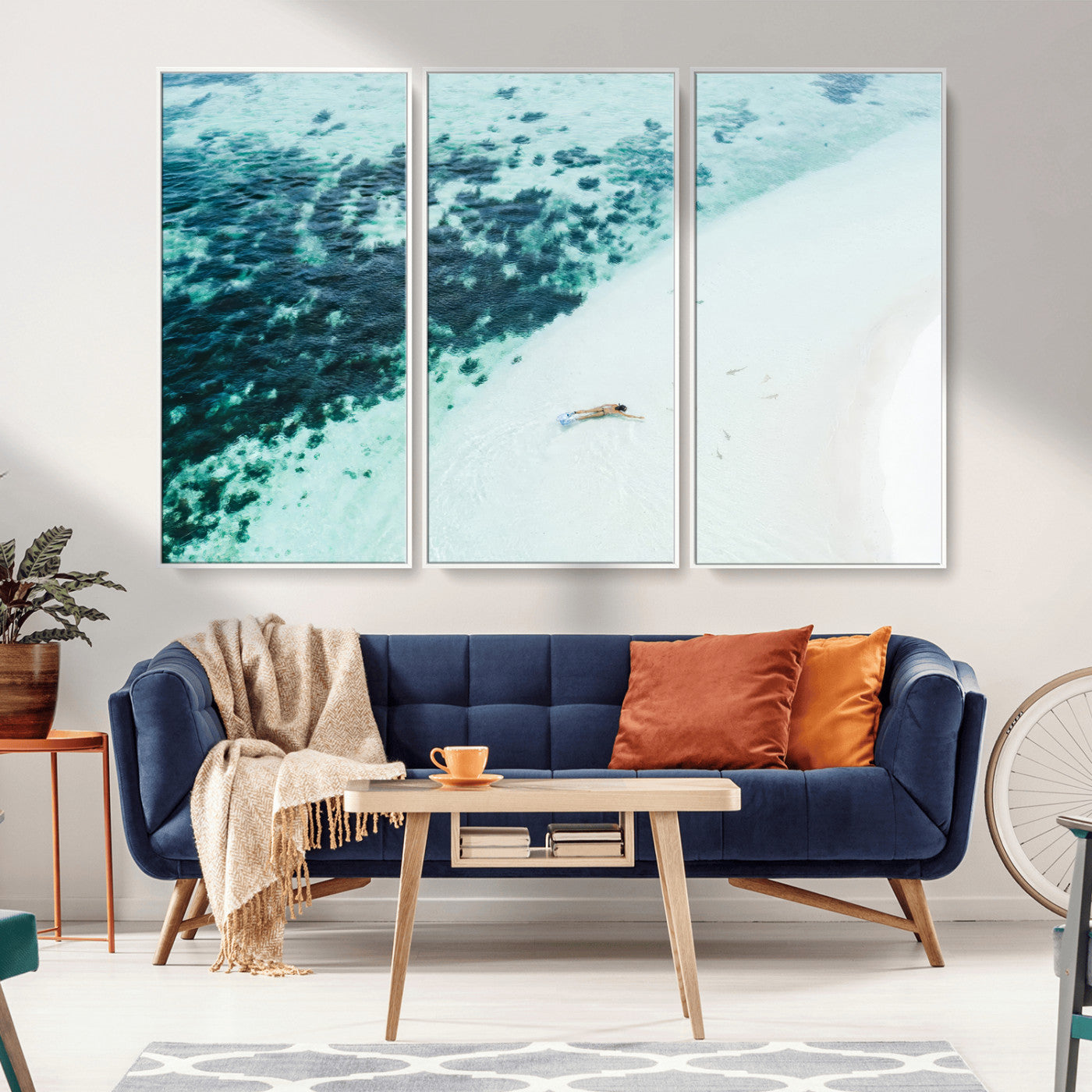 Canvas featuring an aerial view of a swimmer in shallow turquoise waters with coral patterns, ideal for tropical coastal home decor.
