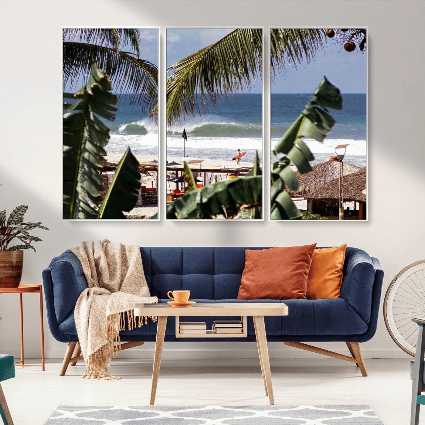 Canvas wall art of a tropical surf scene framed by palm trees, with a surfer on the shore and waves rolling in, ideal for beach-themed decor.