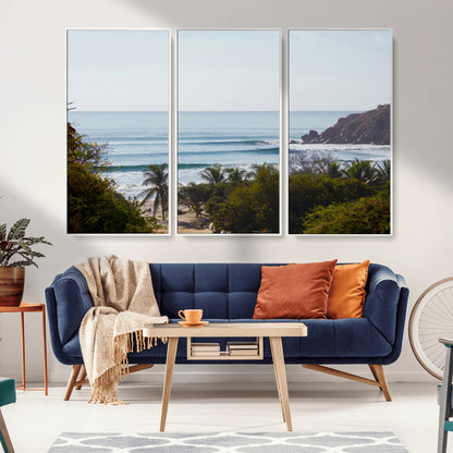 View of calm ocean waves with palm trees and a tropical coastline, ideal for coastal boho or beach-themed wall decor.