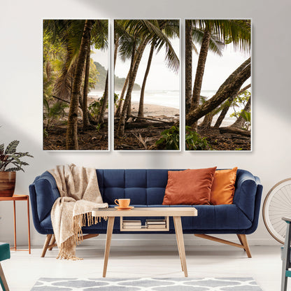 Dense tropical palm trees framing a sandy beach and ocean shore, ideal for jungle or coastal themed interior wall decor.