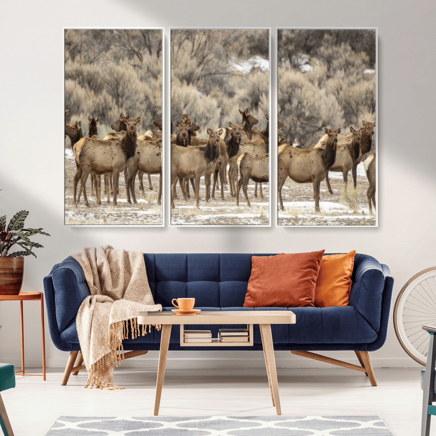 A large herd of elk standing in an open field with soft earthy tones, ideal for rustic lodge or western-themed home wall decor.
