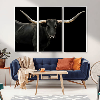 Close-up of a black Texas longhorn with large curved horns on black background, ideal for rustic farmhouse or modern western interiors.