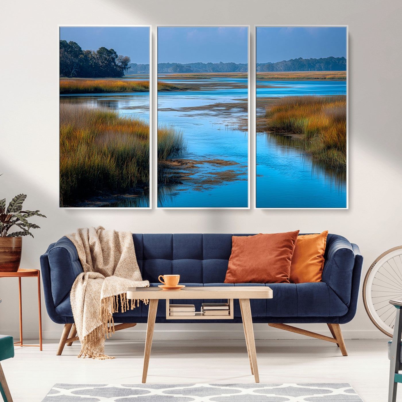 A peaceful marshland scene with calm blue water reflecting the surrounding grasses and trees, capturing the beauty of nature in a serene landscape.