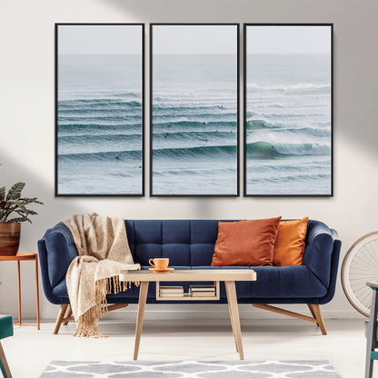 High-angle view of surfers lining up across layered ocean waves, ideal for minimal coastal or surf-inspired room decor.