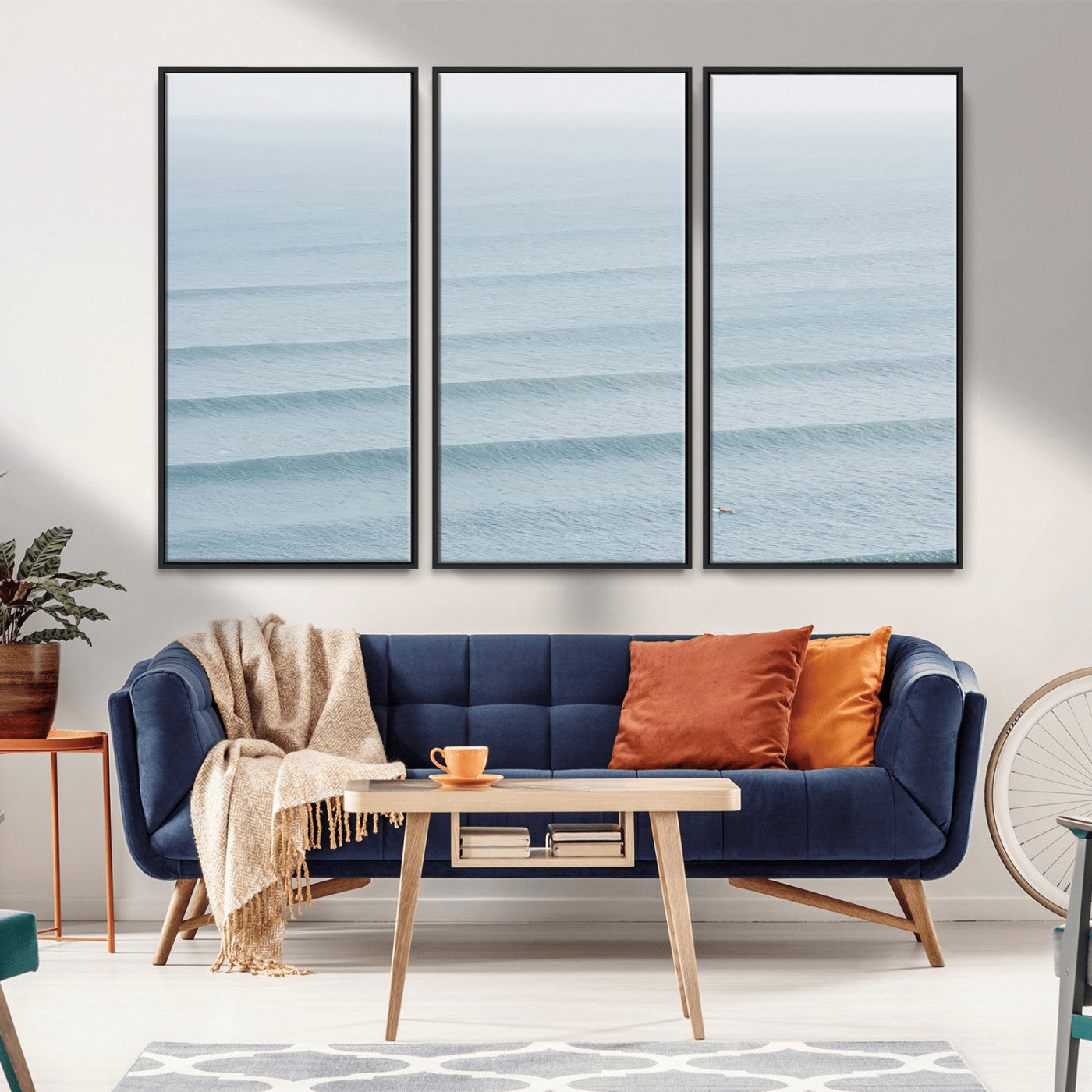 Framed canvas of repeating ocean waves with a distant solo surfer, ideal for minimalist ocean or calm coastal wall decor.