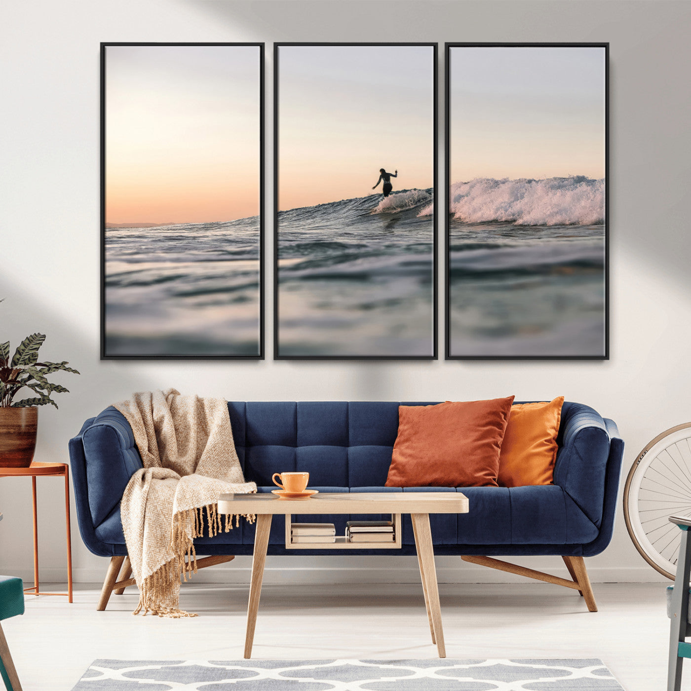 Framed canvas of a female surfer balancing on a wave at sunset, perfect for serene surf or ocean-inspired coastal decor.