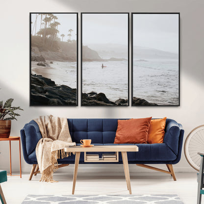 Framed canvas of a surfer in misty coastal tones at a foggy California beach, ideal for minimalist coastal beach or serene ocean-themed decor.