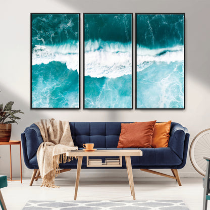 Aerial view of turquoise ocean waves crashing with white foam, perfect for tropical coastal or modern beach-style home decor.