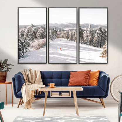 Bright ski trail lined with snow-covered pines and a skier in orange, perfect for alpine adventure or winter sports-inspired decor.