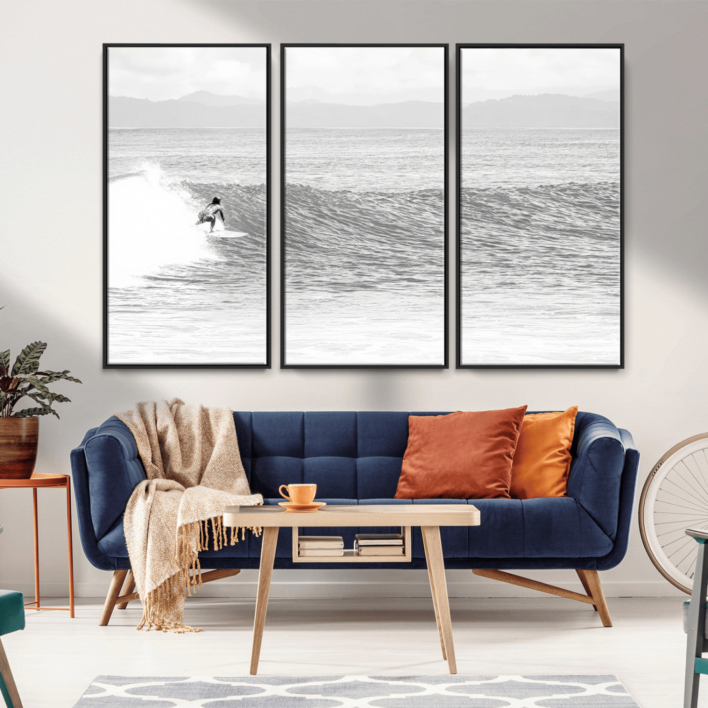 Monochrome photo of a surfer riding a wave with distant mountains, ideal for coastal motion or black and white surf-themed wall decor.