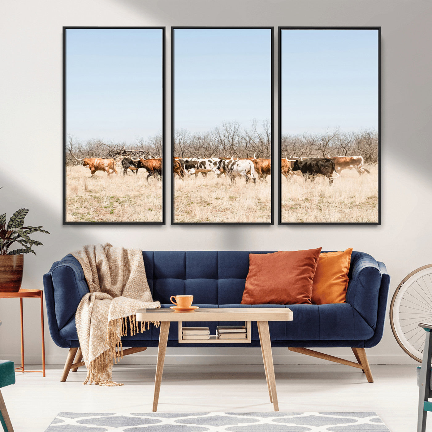 Framed wall art of Texas longhorn cattle walking through a dry, neutral-toned prairie, perfect for rustic farmhouse or western-themed home decor.