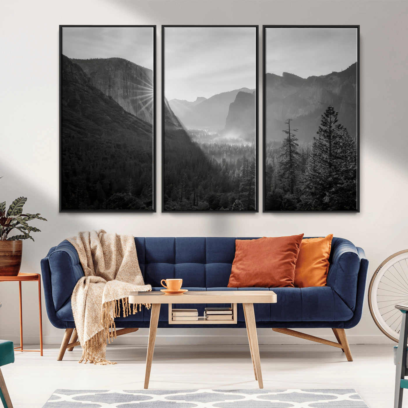 Black and white landscape of Yosemite with sun rays peeking over El Capitan, ideal for moody nature or modern rustic decor.