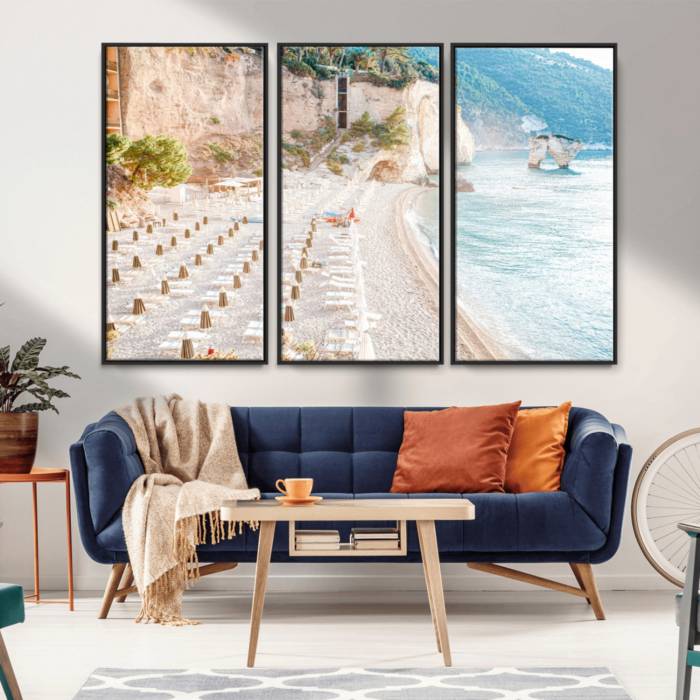 Wall art of a calm Mediterranean beach with rows of sun loungers and umbrellas in soft pastel tones, perfect for light coastal or vacation-themed decor.