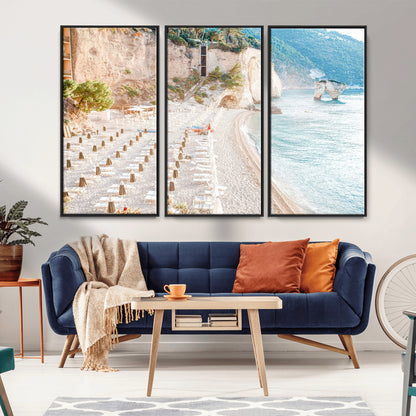 Wall art of a calm Mediterranean beach with rows of sun loungers and umbrellas in soft pastel tones, perfect for light coastal or vacation-themed decor.