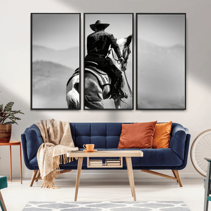 Black and white canvas of a cowboy on horseback with moody tones, perfect for rustic western or country-inspired home decor.