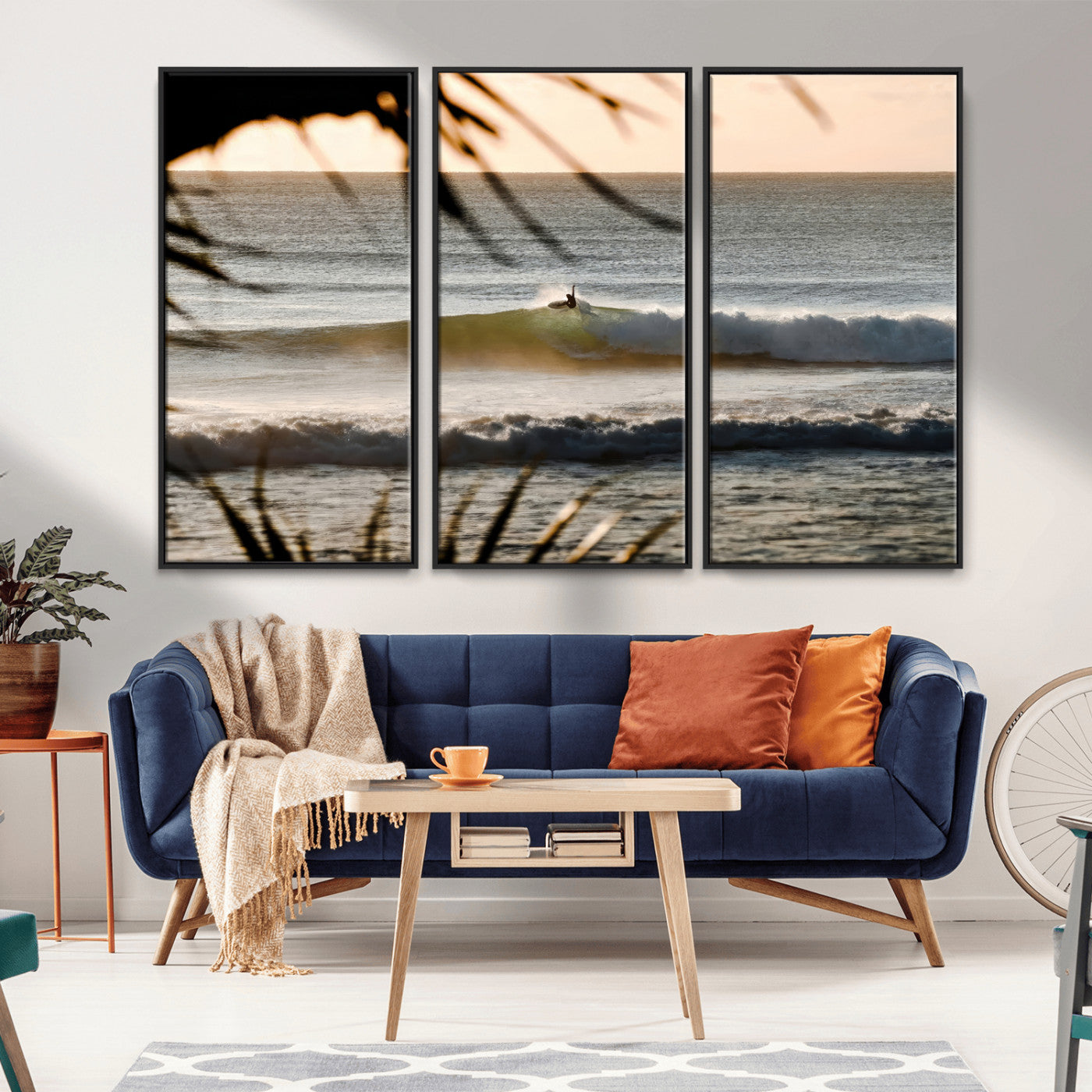 Photo of a surfer riding a golden hour wave at sunset, with tropical tones and dreamy light, perfect for tropical boho or coastal home decor.