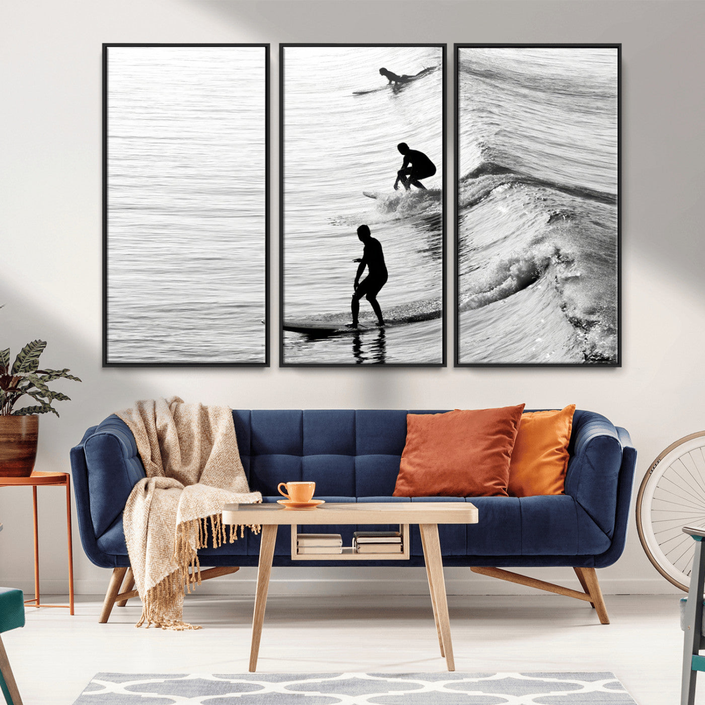Black and white photo of surfers riding waves in a moody, high-contrast scene, ideal for modern coastal or surf-inspired home decor.