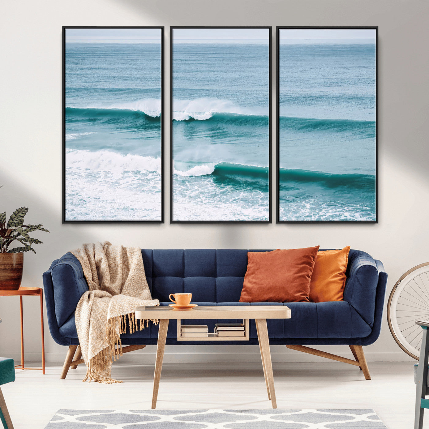 Powerful ocean waves rolling towards the shore, their turquoise hues blending with white sea foam under an open horizon, capturing the essence of the ocean's movement.