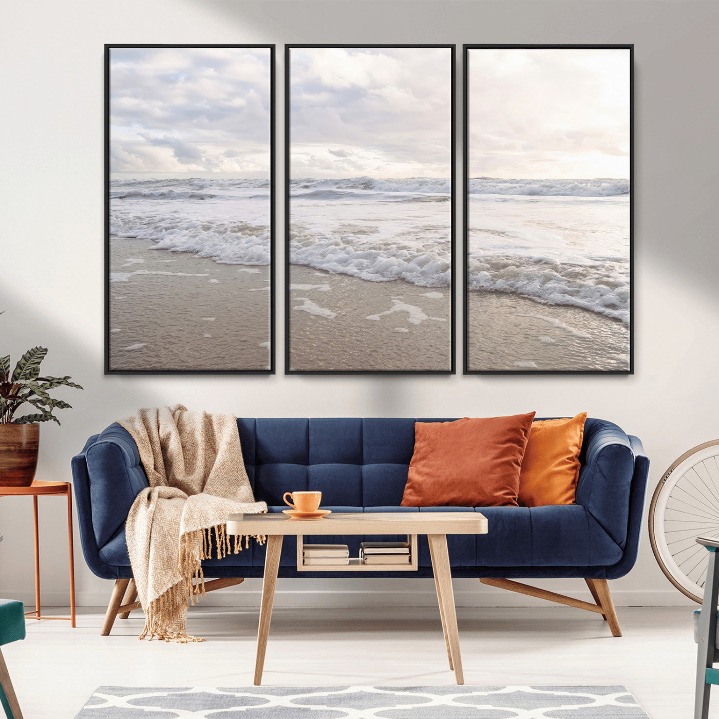 Peaceful ocean waves rolling onto the sandy shore under soft light, perfect for neutral or coastal minimalist decor themes.