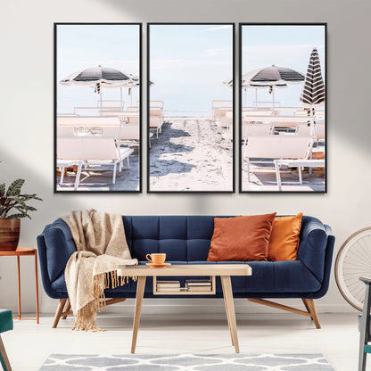 A serene minimalist beach scene featuring striped umbrellas, soft pastel sand, and an elegant lounge setup, creating a tranquil and stylish coastal retreat.