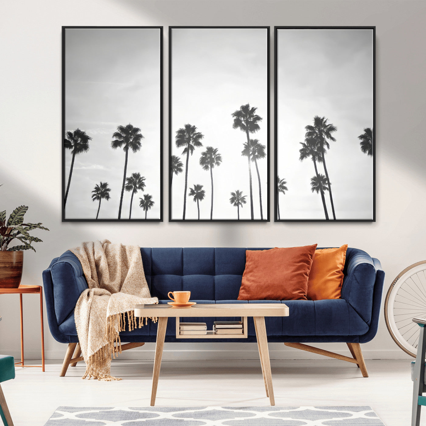 A black and white minimalist scene featuring tall palm trees silhouetted against a bright sky, creating a dreamy and timeless tropical aesthetic.