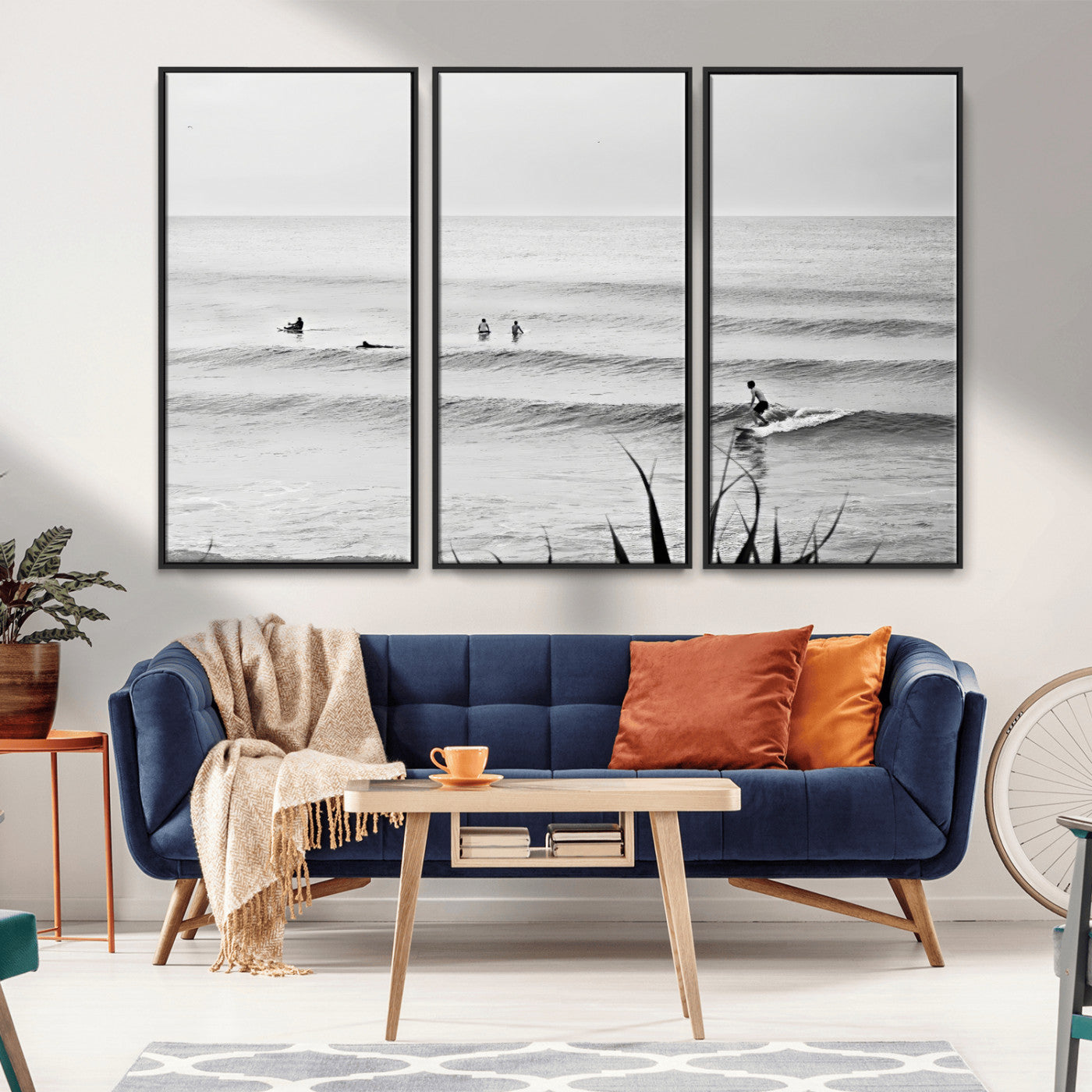Monochrome canvas of surfers on calm ocean waves, ideal for minimalist coastal or beach-inspired interior decor.