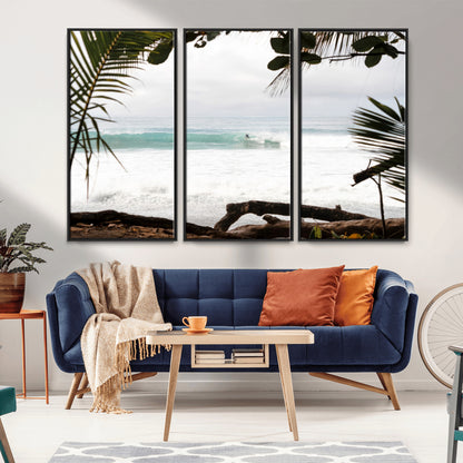 Tropical beach view with palm trees and surfer riding a wave, perfect for boho or coastal-inspired interior wall decor.