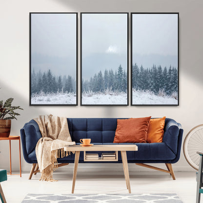 Snow-covered forest under misty sky, soft light breaking through clouds, ideal for minimalist or Nordic-inspired home decor.