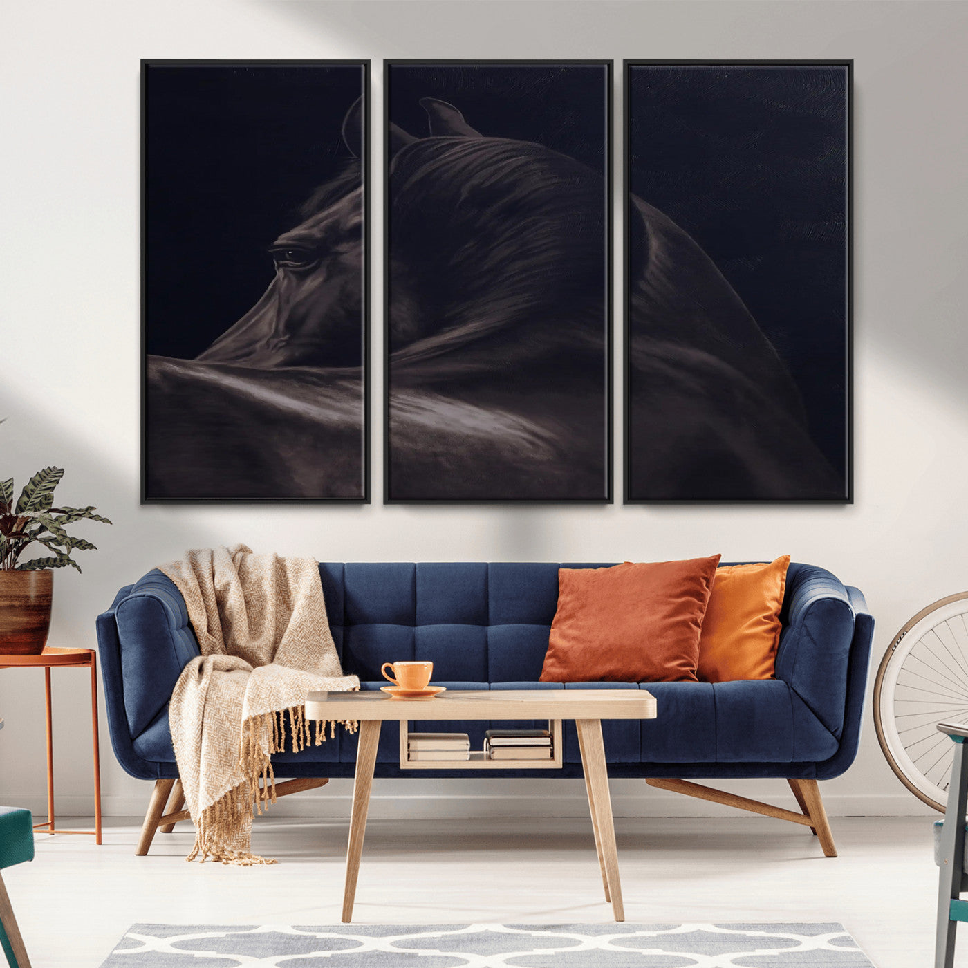 Close-up of a black horse with dramatic lighting on a dark background, perfect for rustic or masculine home decor.