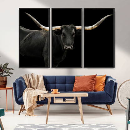 Close-up of a black Texas longhorn with large curved horns on black background, ideal for rustic farmhouse or modern western interiors.