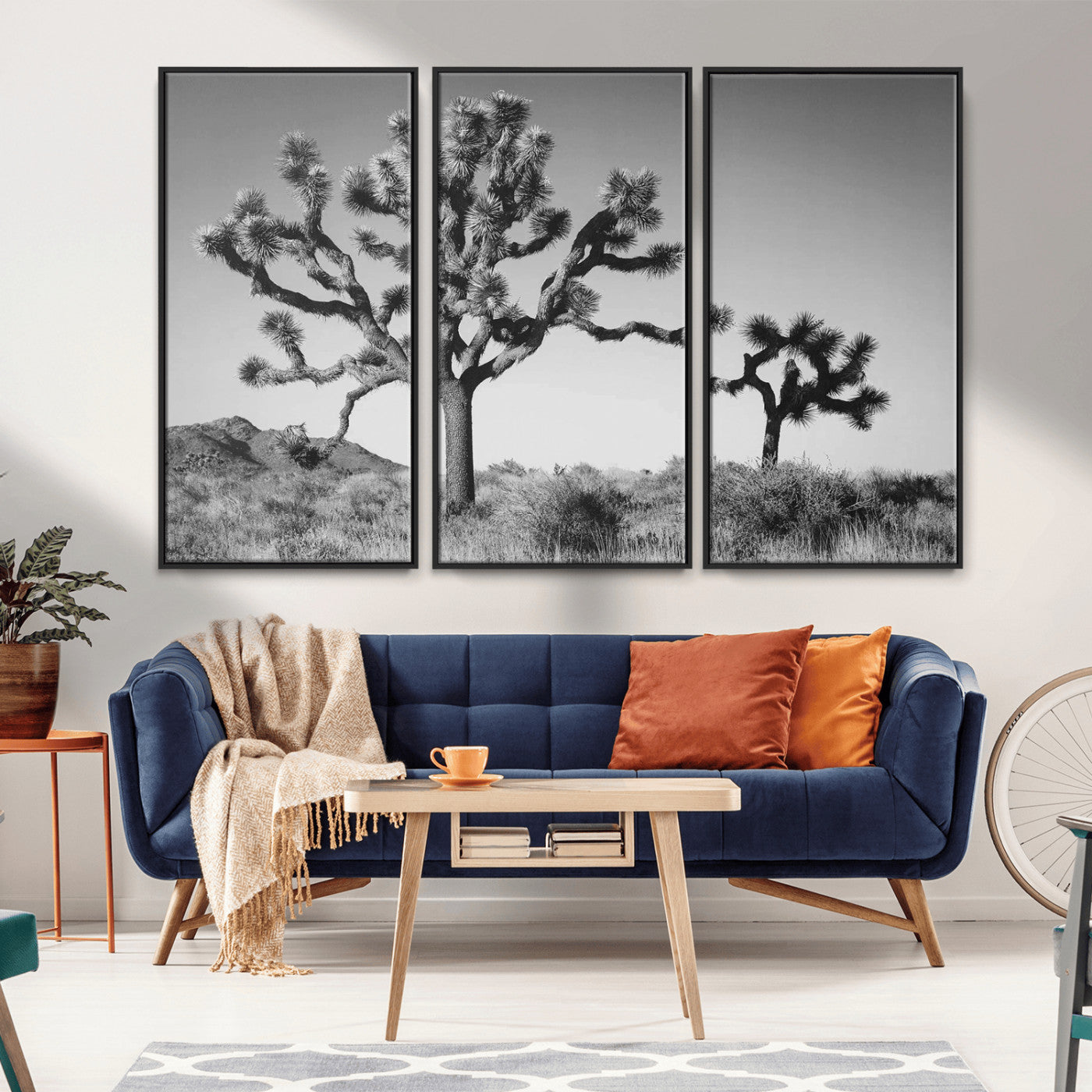 Black and white Joshua trees in a rugged desert landscape, creating a calm and minimalist feel for natural or rustic-themed interiors.