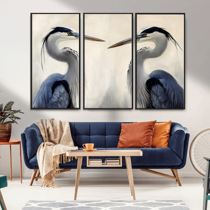 Two blue herons facing each other on a soft neutral background, ideal for coastal, tranquil, or nature-inspired minimalist interiors.