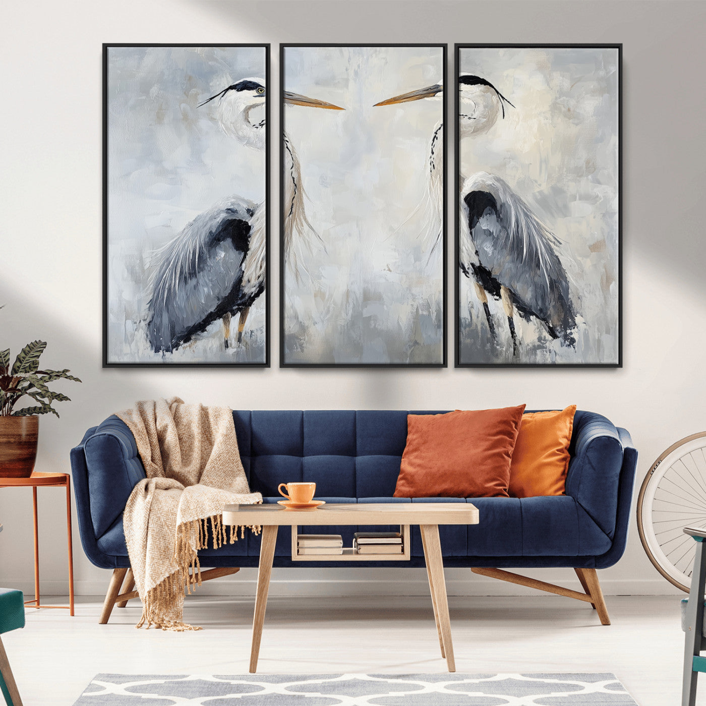 Two herons facing each other on a soft-toned background with blue-grey feathers, perfect for tranquil, coastal or nature-themed interiors.