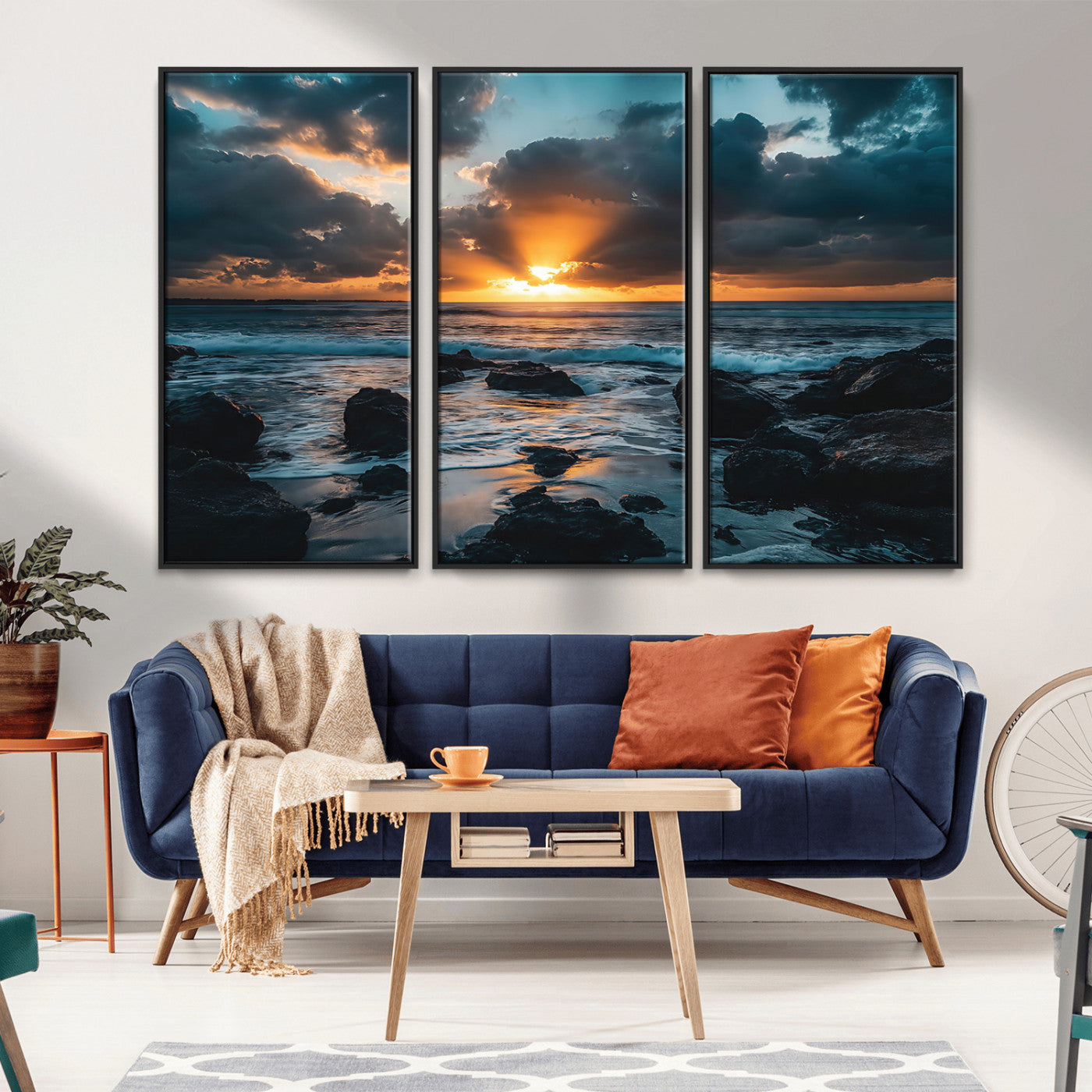 An awe-inspiring sunset over the ocean with rays of light piercing through dramatic clouds, creating a beautiful seascape with rocks in the foreground.