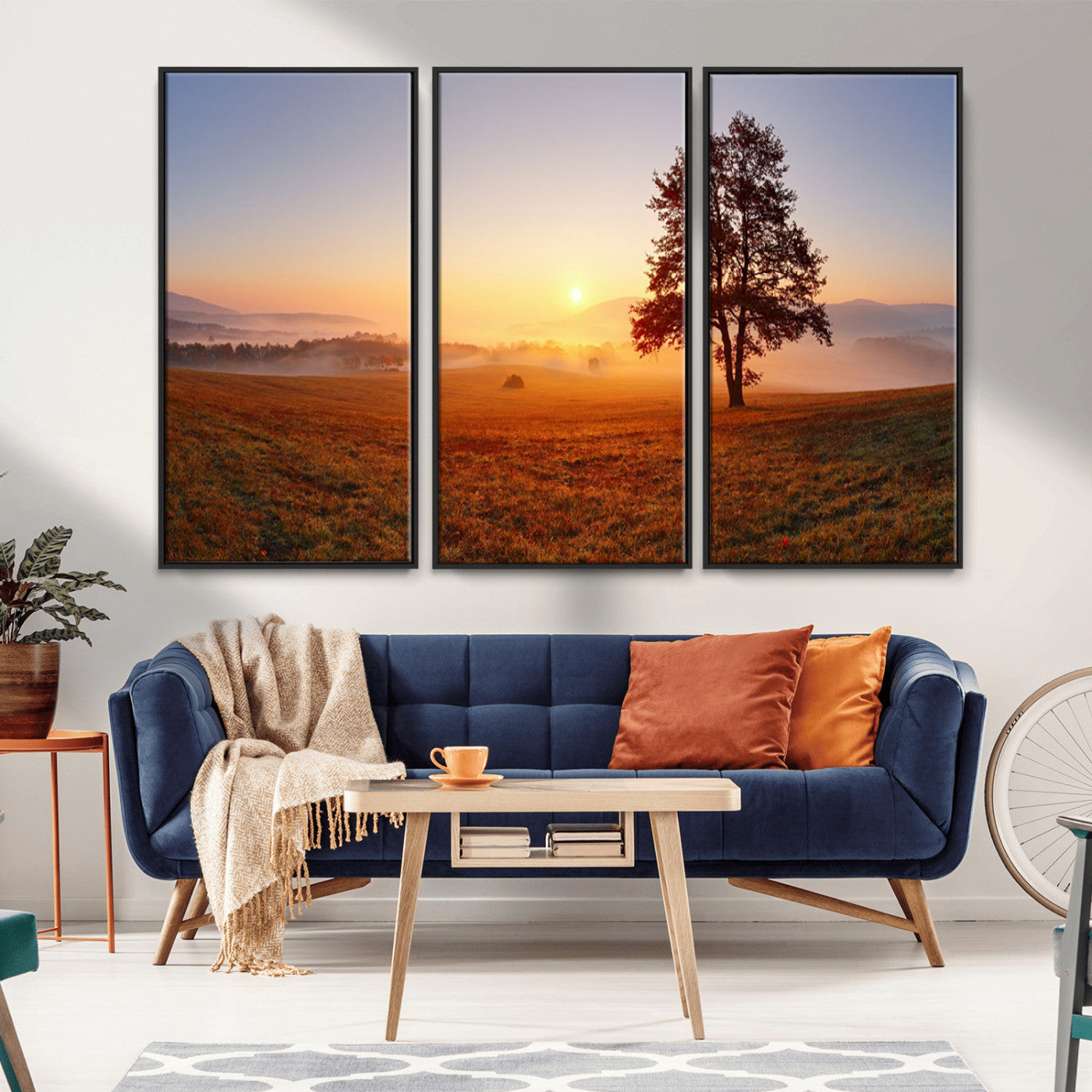 A tranquil landscape at sunrise with a mist-covered field and a lone tree, creating a peaceful and natural atmosphere.