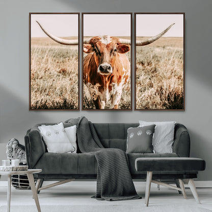 Framed longhorn cow canvas wall art with rustic prairie background, western animal print perfect for farmhouse or ranch style decor