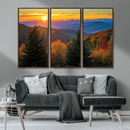 Vibrant sunset over autumn mountains with colorful trees and warm light, ideal for nature lovers or cabin-style wall decor.