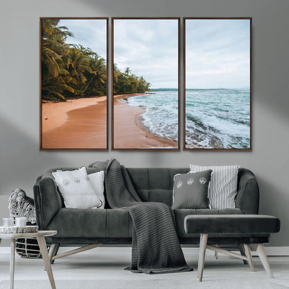 Framed canvas of a tropical beach with palm trees and soft waves, ideal for coastal escape or serene nature-inspired home decor.