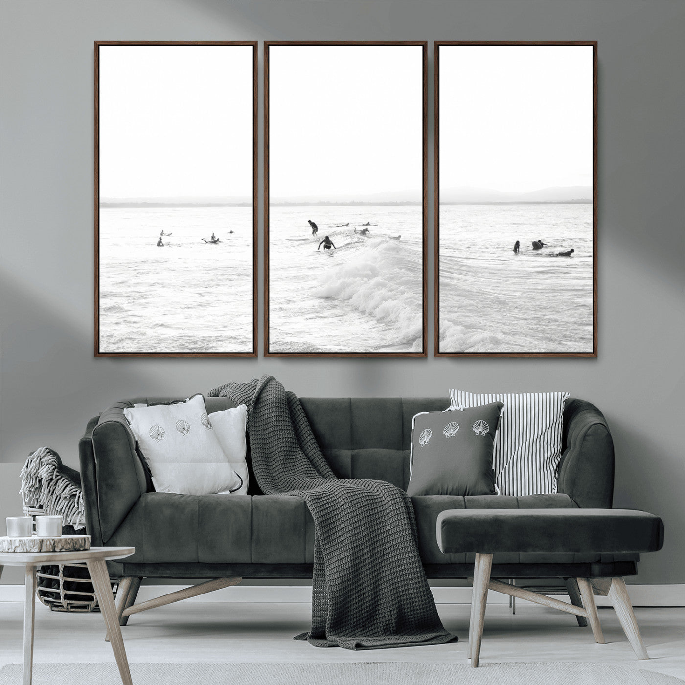 Monochrome photo of surfers riding and waiting on ocean waves, ideal for surf-themed or coastal energy wall decor.