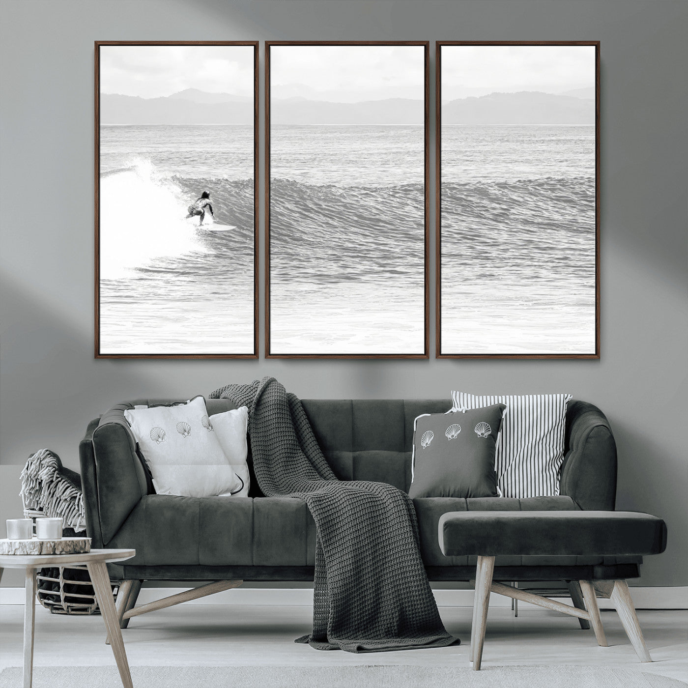 Monochrome photo of a surfer riding a wave with distant mountains, ideal for coastal motion or black and white surf-themed wall decor.