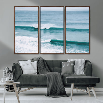 Powerful ocean waves rolling towards the shore, their turquoise hues blending with white sea foam under an open horizon, capturing the essence of the ocean's movement.
