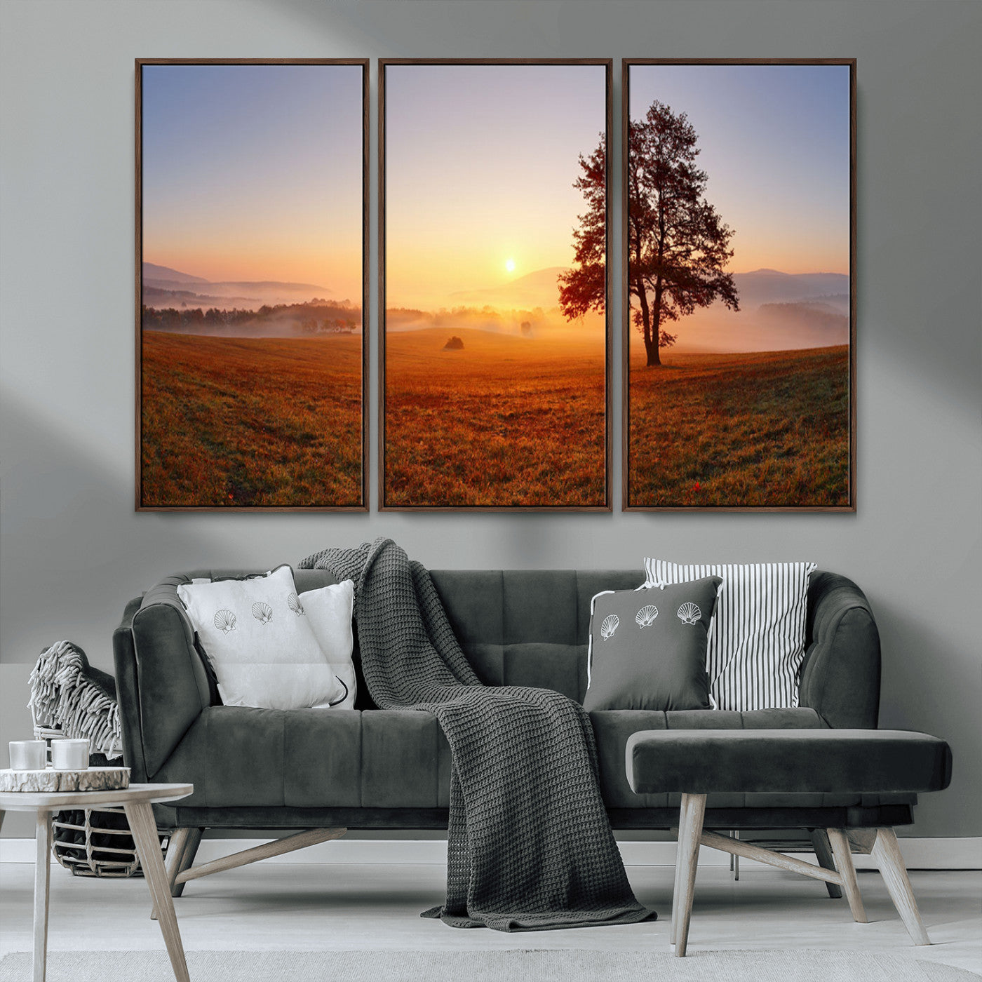 A tranquil landscape at sunrise with a mist-covered field and a lone tree, creating a peaceful and natural atmosphere.