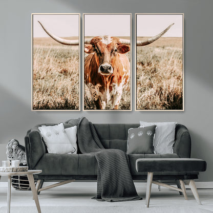 Framed longhorn cow canvas wall art with rustic prairie background, western animal print perfect for farmhouse or ranch style decor