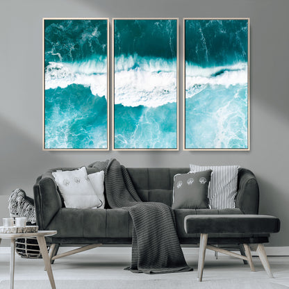 Aerial view of turquoise ocean waves crashing with white foam, perfect for tropical coastal or modern beach-style home decor.