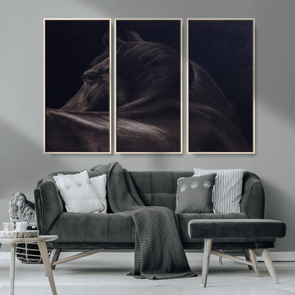 Close-up of a black horse with dramatic lighting on a dark background, perfect for rustic or masculine home decor.